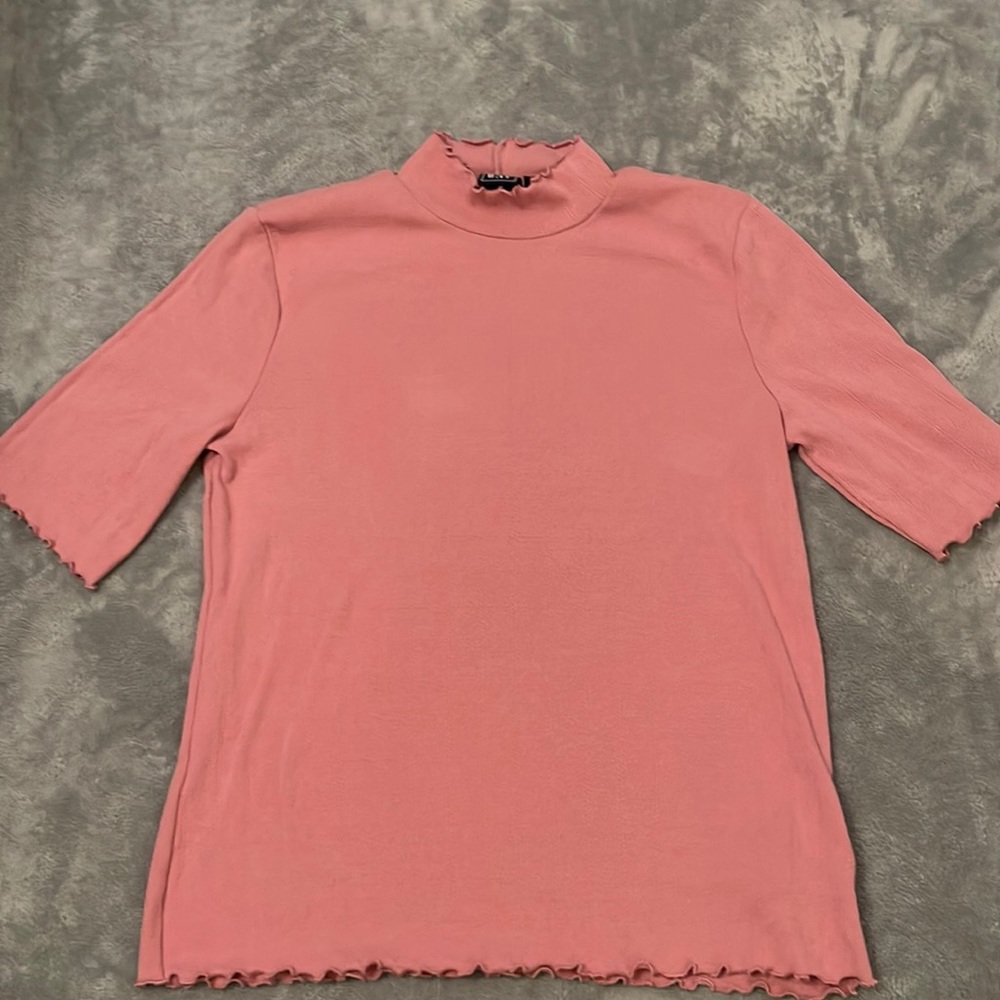 Pink mock neck with ruffled hems